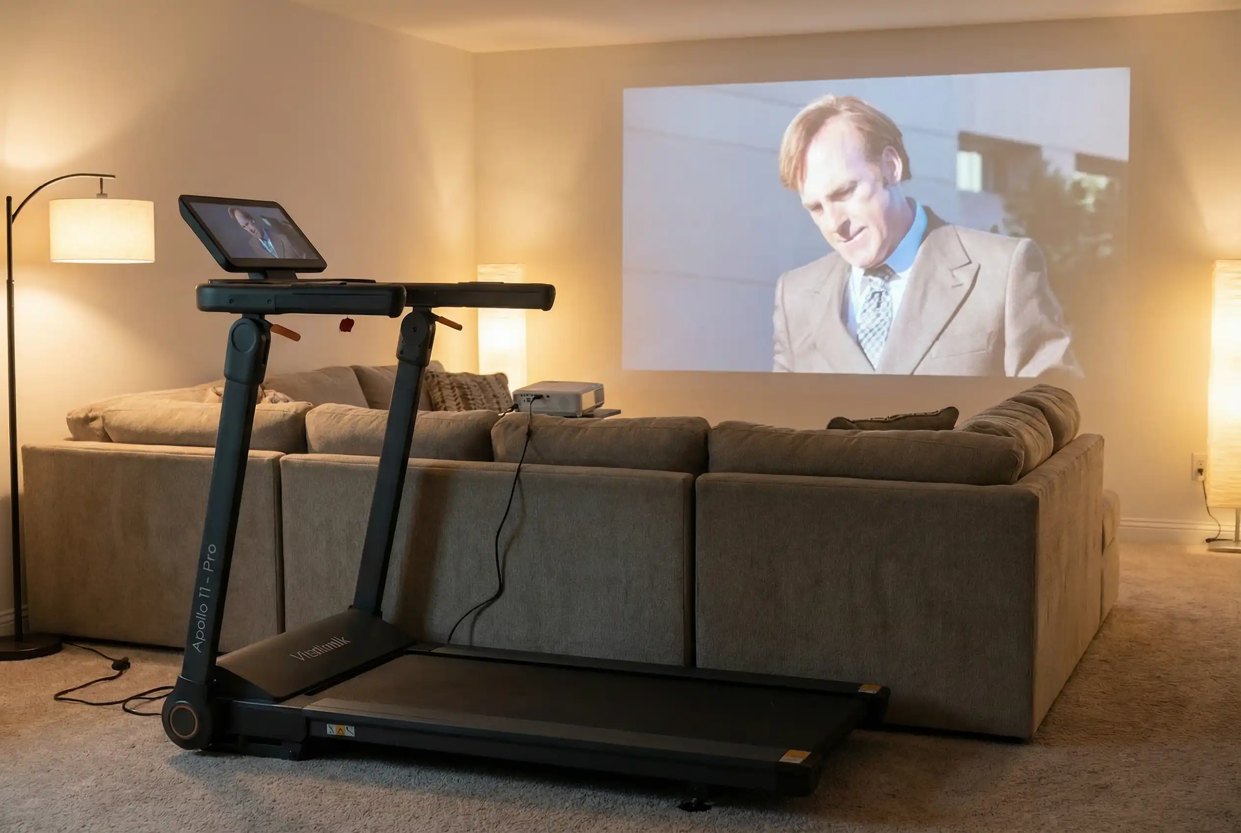 VITALWALK Apollo 11 Pro walking pad treadmill with support handles in a home theater living room setup