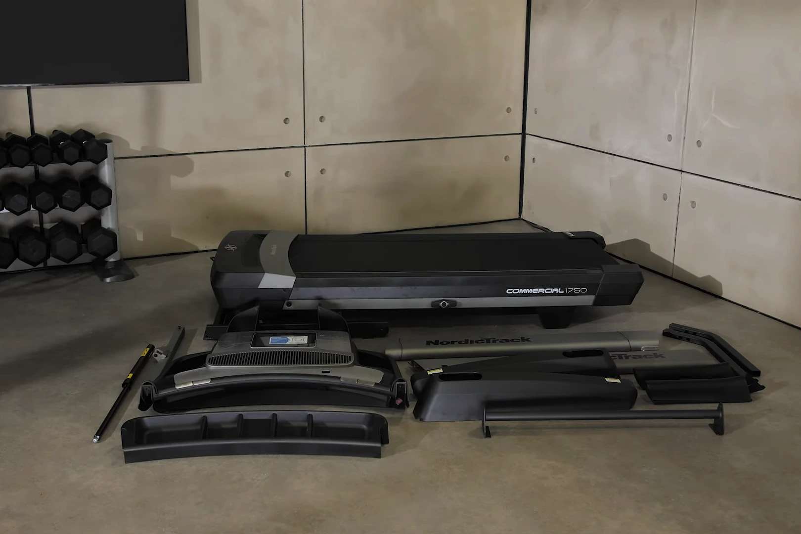nordic track parts NordicTrack Commercial 1750 treadmill parts laid out before assembly – base unit, console, frame and components