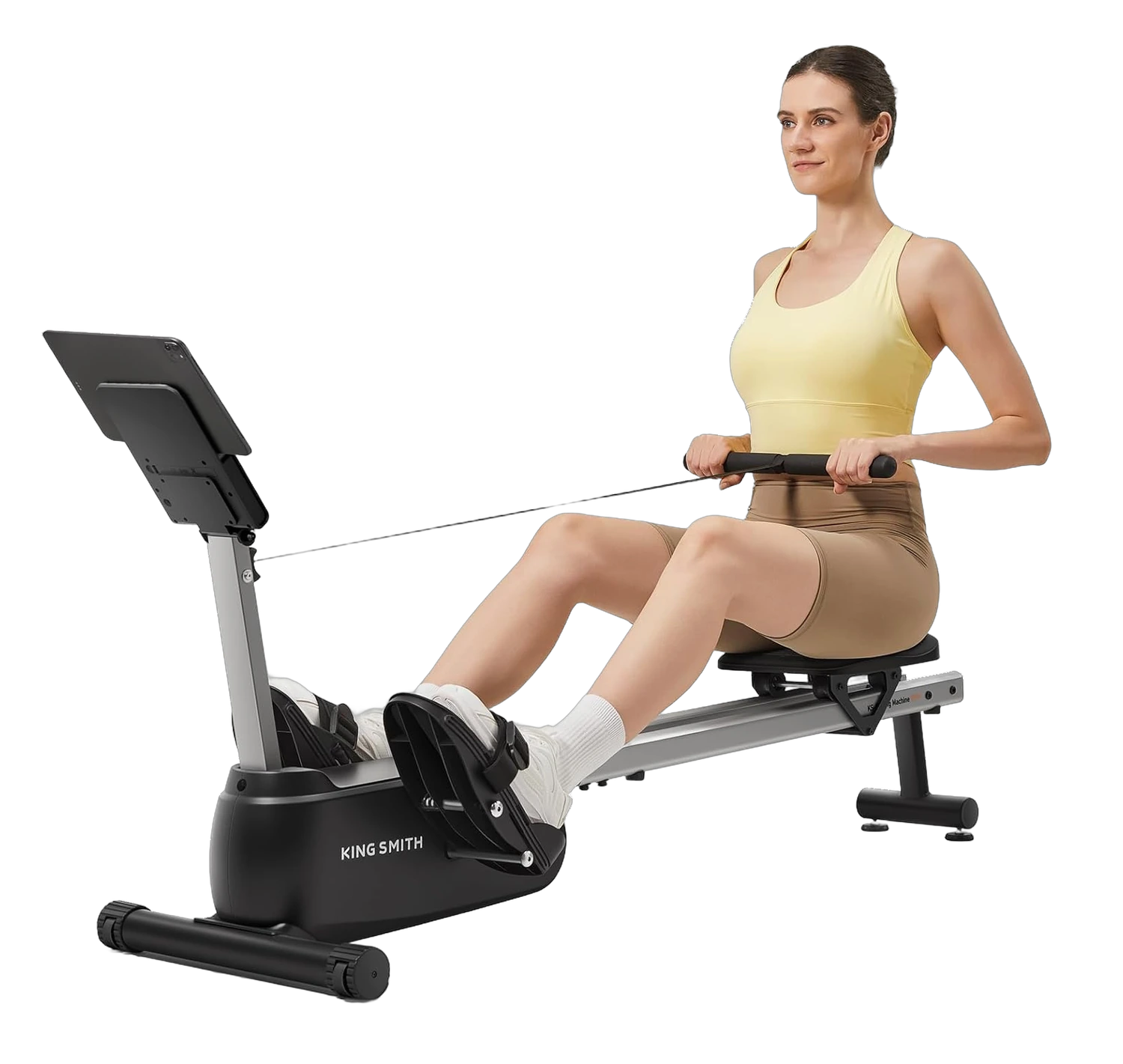 Woman using a KingSmith foldable rowing machine with a tablet holder and padded seat