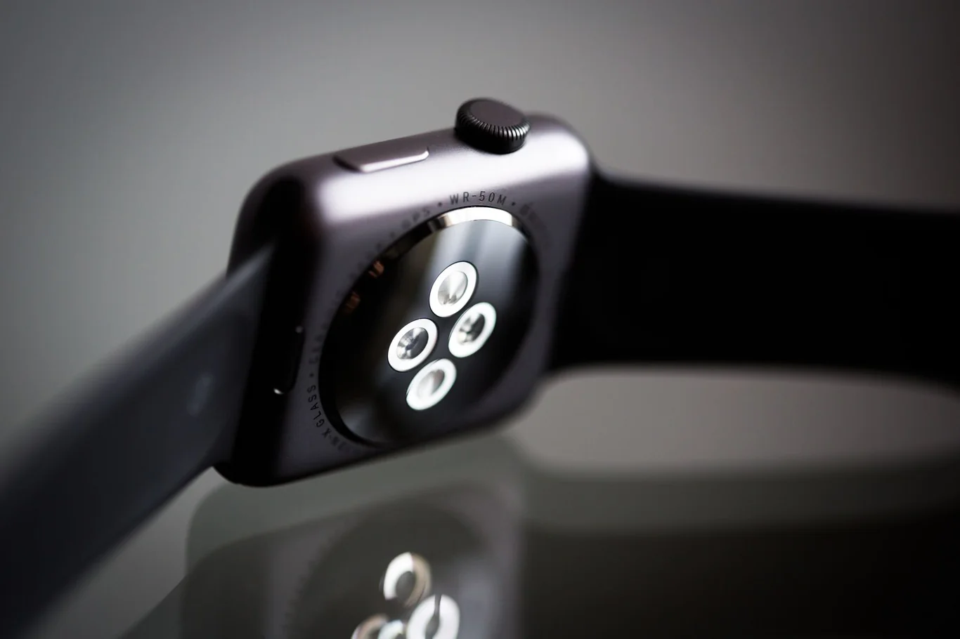 Smartwatch underside showing the optical heart rate sensor LEDs