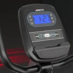 Close-up of the JOROTO recumbent bike console showing the backlit LCD display and handlebar grips