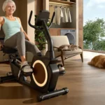 Senior woman comfortably seated and pedaling the JOROTO recumbent bike at home