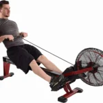 Man rowing the Stamina X Air Rower, studio shot