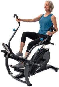 Woman using the Teeter FreeStep LT3 recumbent cross trainer