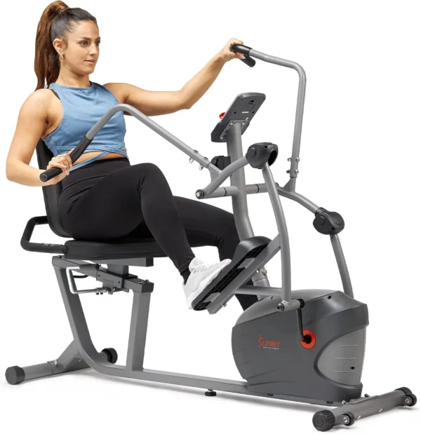 Woman using the Sunny SF-RBE420035 recumbent elliptical cross trainer, side view