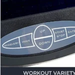 Sunny Health & Fitness Elite Recumbent Cross Trainer console control buttons close-up: recovery, mode, up, down, start stop, enter