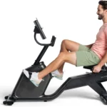 Person riding the Schwinn 290 recumbent bike, side profile