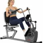 Woman using the VANSWE recumbent elliptical cross trainer, pedaling with arm exerciser handles in motion