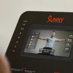 Close-up of Sunny SF-T724082 touchscreen console showing workout class display