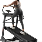 Person climbing on inclined Sunny SF-X7210 treadmill, rear view