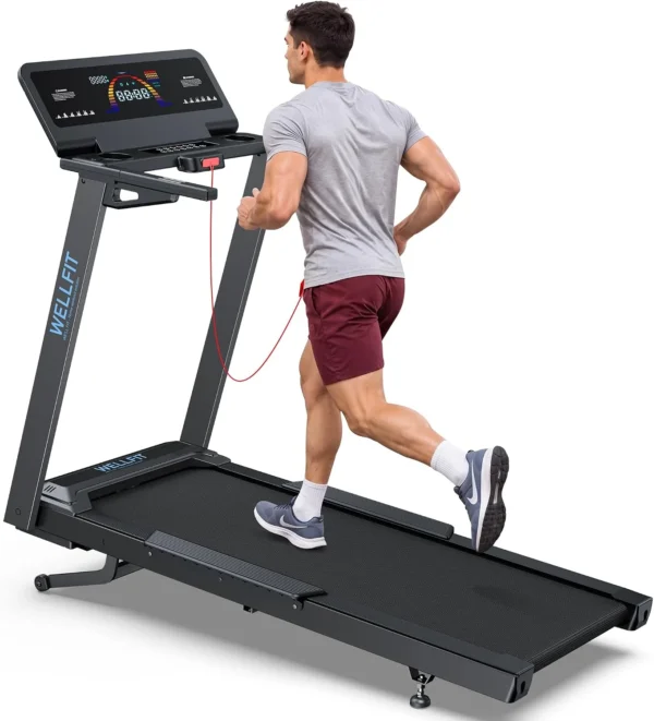 WELLFIT 15% auto incline treadmill, man running, rear angle full studio view