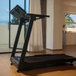 WELLFIT treadmill folded console shown in a bright home interior