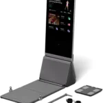 Full K1 unit with folded bench and lit screen beside the bar, ankle straps, and body scale