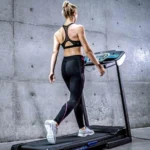 Woman walking on the XTERRA TRX1000 treadmill, rear view