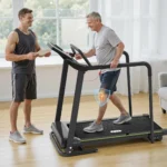 A companion coaching a senior through a walk on the Redliro slow-start treadmill