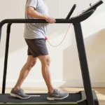 Side profile of a walker using the Redliro slow-start senior treadmill at 0 percent incline