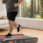 Runner on the Vitalwalk Apollo 11-Max full-deck walking pad, showing its 400 lb capacity build