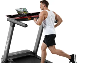 Renestar folding auto incline treadmill, man running, rear three-quarter studio view