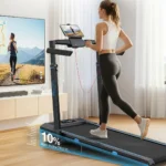Woman running on the WELLFIT 400+ lb treadmill with a tablet holder and scenic run on the TV