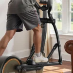 Close-up of a man's legs and the console on the Niceday elliptical mid-stride