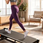 Side profile of a woman running on the Vitalwalk Apollo 11-Vibe walking pad