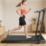 Side profile of a runner using the JAGJOG walking pad with the height-adjustable handlebar raised