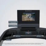 NordicTrack T Series 10 treadmill console close-up showing 10 inch tilt and pivot touchscreen, incline and speed buttons, cup holder