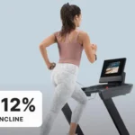 Runner using the NordicTrack T Series 10 treadmill at 12 percent incline, rear angle