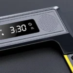 TOPUTURE treadmill console close-up showing LED display and speaker