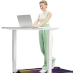 Person using the UREVO CyberPad under a standing desk with a laptop