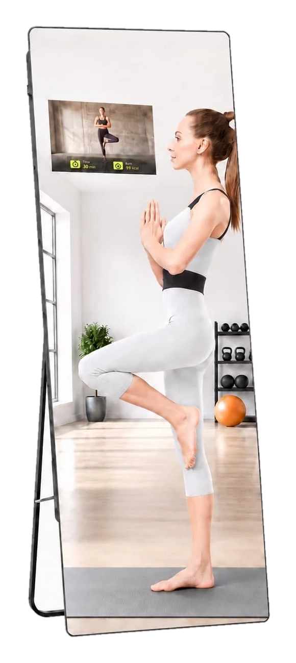 Freestanding smart fitness mirror with built-in display in a home workout corner