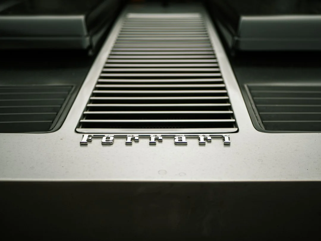 Close-up of a treadmill motor housing vent panel with horizontal aluminum slats