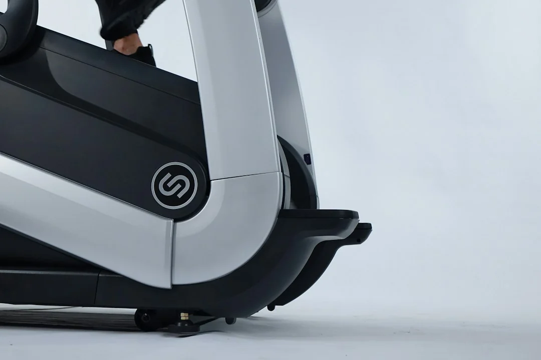 Close-up of a treadmill base and motor housing against a white background