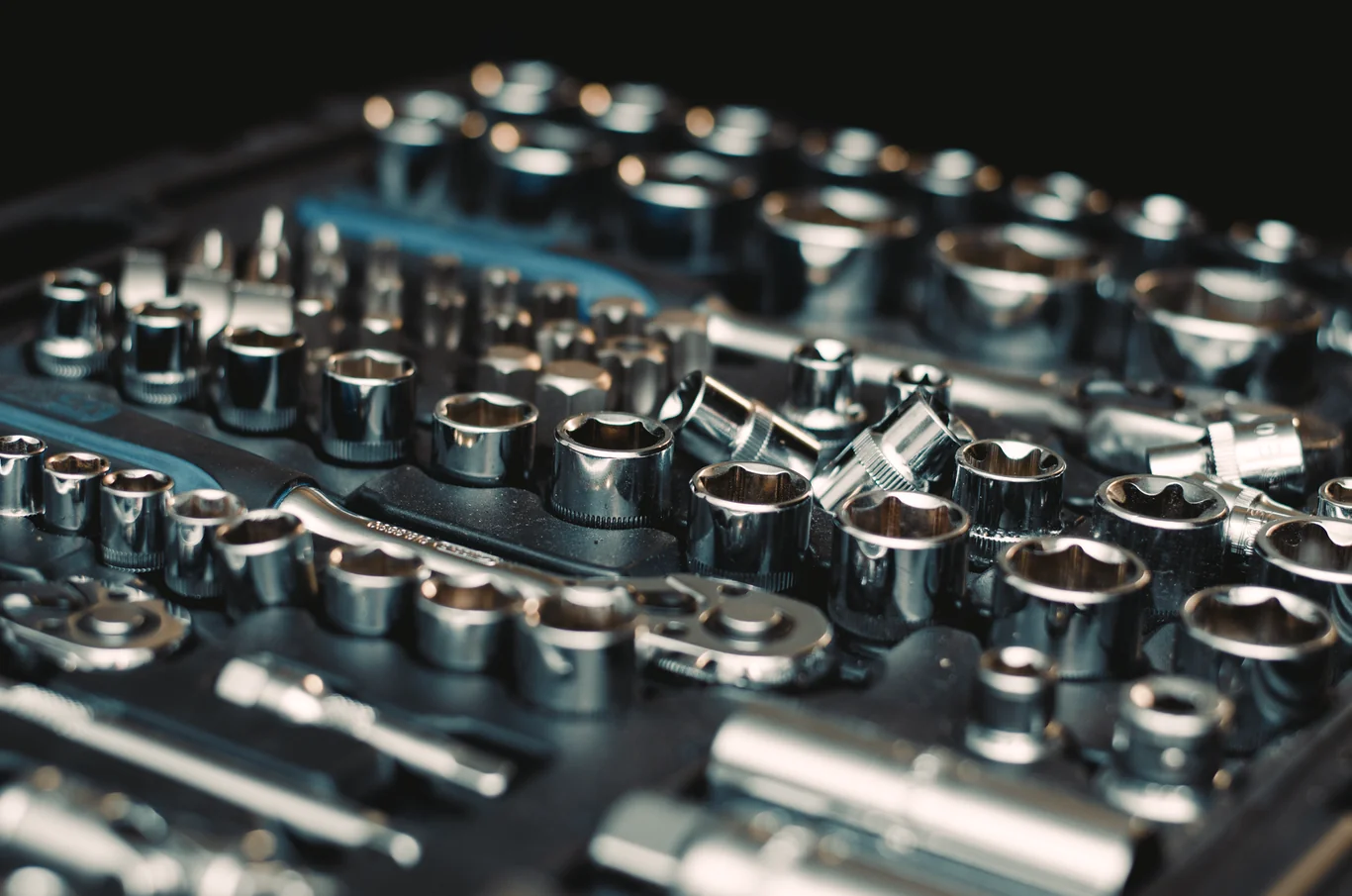 Socket wrench set with multiple sizes laid out in a tool case